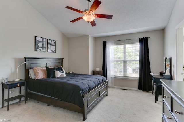 bedroom featuring baseboards, light colored carpet, vaulted ceiling, and visible vents