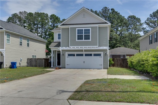 view of front of house with fence, driveway, a front lawn, and a garage