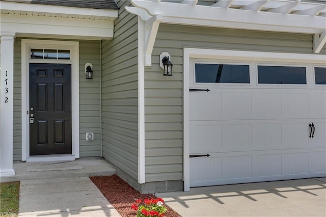 property entrance with a garage