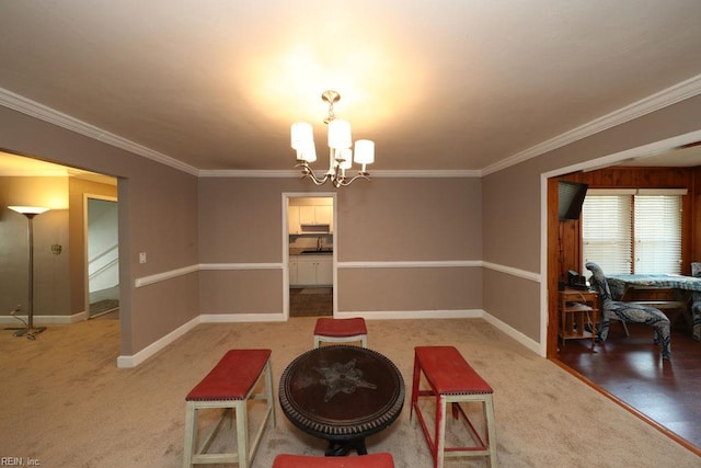 8562 Executive Dr Unit B2, Norfolk, VA 23503 - living area with an inviting chandelier, ornamental molding, baseboards, and light carpet