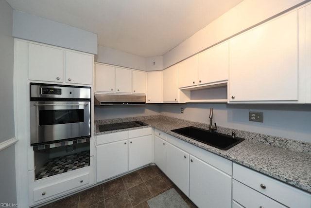 8562 Executive Dr Unit B2, Norfolk, VA 23503 - kitchen with white cabinets, oven, a sink, black electric cooktop, and under cabinet range hood