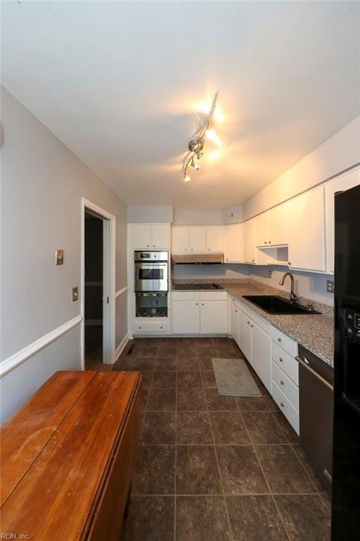 8562 Executive Dr Unit B2, Norfolk, VA 23503 - kitchen with a sink, stainless steel oven, black refrigerator with ice dispenser, and white cabinets