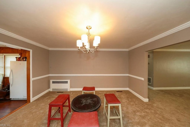 8562 Executive Dr Unit B2, Norfolk, VA 23503 - carpeted dining room with baseboards, a notable chandelier, ornamental molding, and radiator heating unit