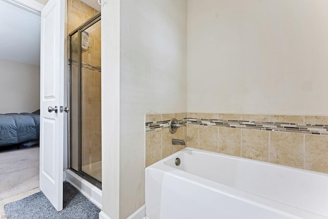 ensuite bathroom with a stall shower, a bath, and connected bathroom