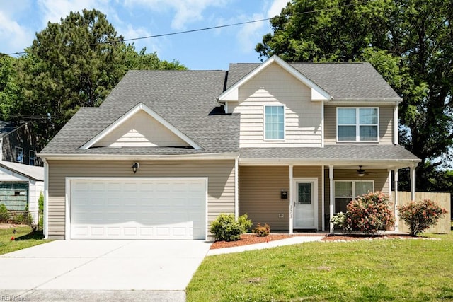 view of front of house with a garage, a front yard, a shingled roof, concrete driveway, and a porch
