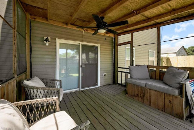 sunroom featuring ceiling fan
