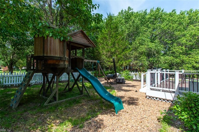 view of jungle gym featuring fence
