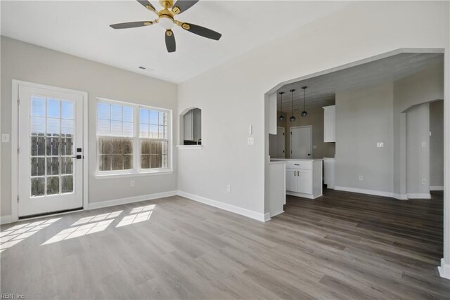 3612 Purebred Dr, Virginia Beach, VA 23453 - unfurnished living room with a ceiling fan, baseboards, and wood finished floors