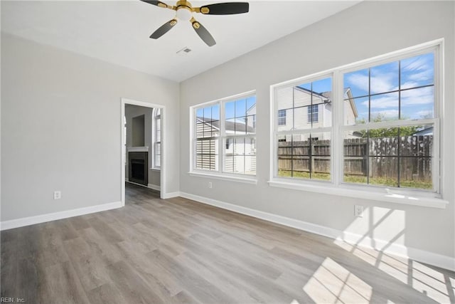 3612 Purebred Dr, Virginia Beach, VA 23453 - spare room with baseboards, ceiling fan, a fireplace, and wood finished floors