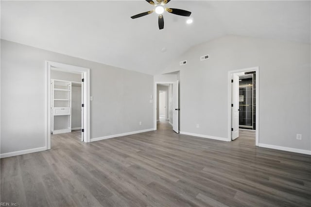 3612 Purebred Dr, Virginia Beach, VA 23453 - unfurnished bedroom with baseboards, wood finished floors, a spacious closet, lofted ceiling, and visible vents