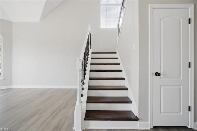 3612 Purebred Dr, Virginia Beach, VA 23453 - staircase featuring baseboards, arched walkways, and wood finished floors