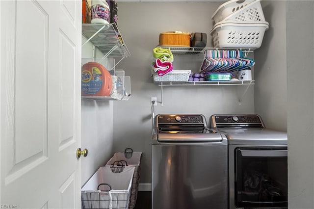 laundry area with laundry area and independent washer and dryer