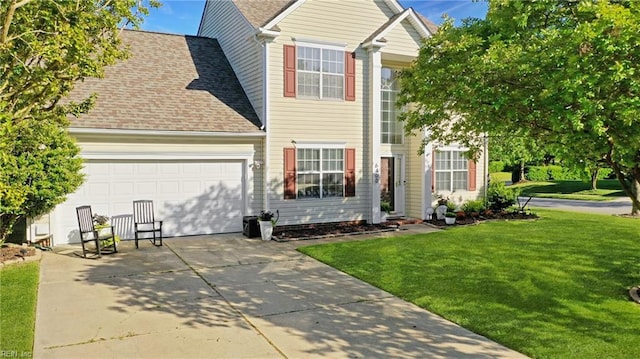 traditional-style house with concrete driveway, an attached garage, roof with shingles, and a front lawn