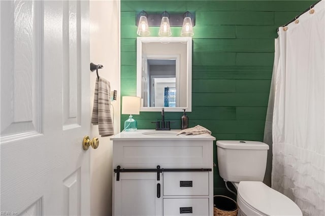 full bathroom featuring vanity and toilet
