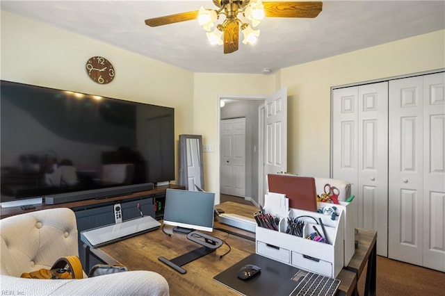 living room featuring a ceiling fan