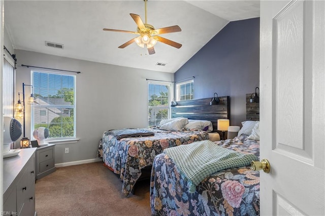 bedroom with visible vents, multiple windows, and vaulted ceiling