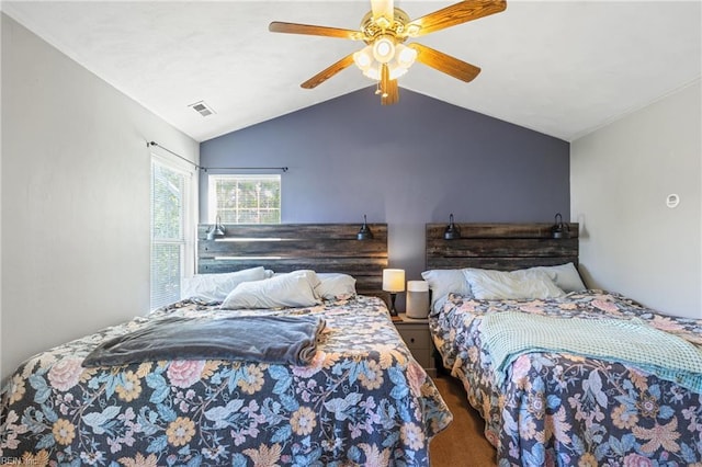 bedroom featuring vaulted ceiling, a ceiling fan, carpet flooring, and visible vents