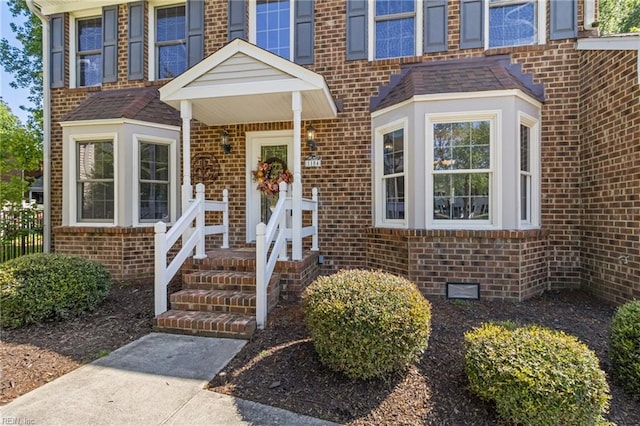 entrance to property with brick siding