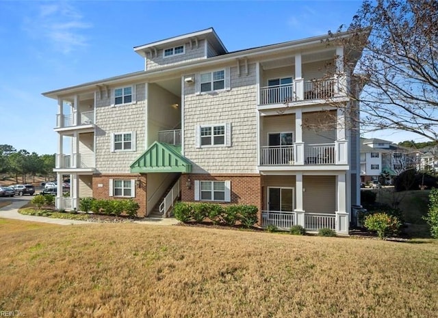 4309 Hillingdon Bnd Unit 303, Chesapeake, VA 23321 - view of front of property with brick siding and a front yard