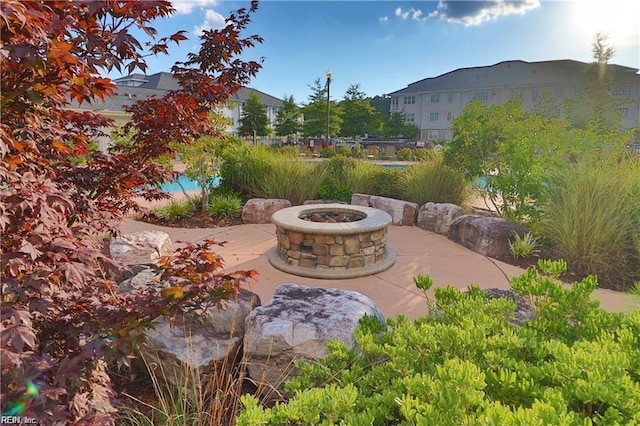 view of patio / terrace with an outdoor fire pit