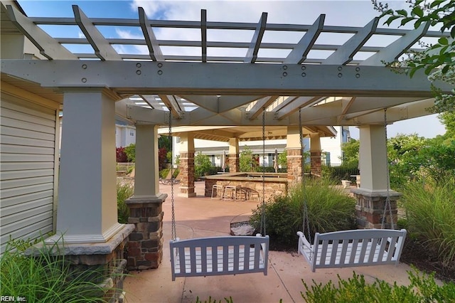 view of patio featuring a gazebo and outdoor dry bar