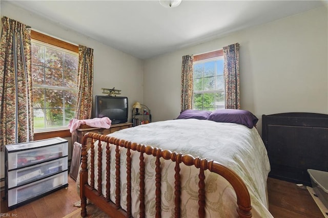 bedroom with wood finished floors