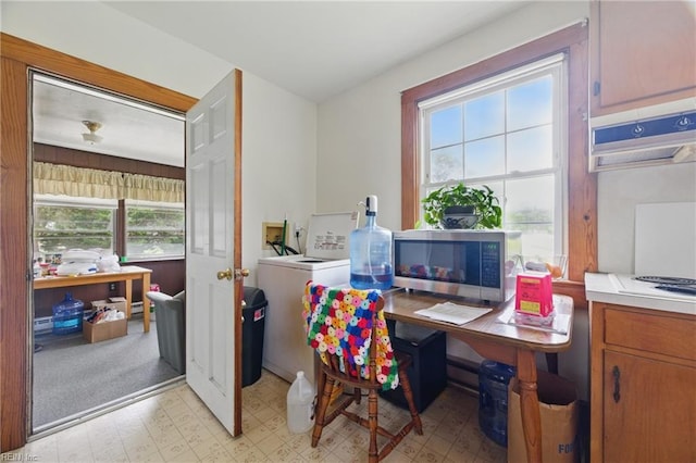 office area featuring light floors and washer / clothes dryer