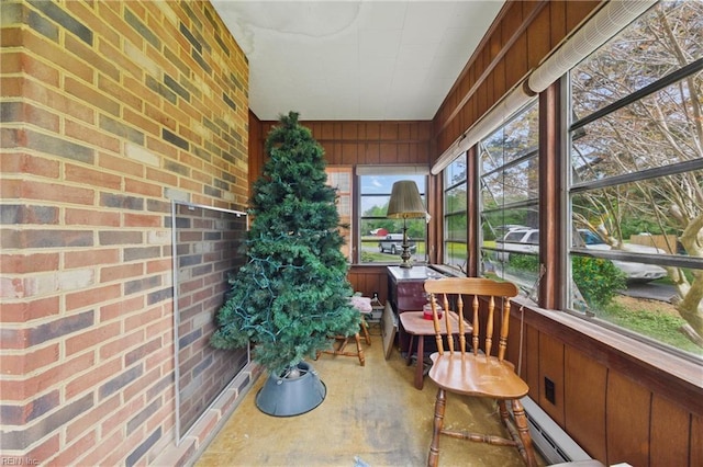 sunroom with brick wall