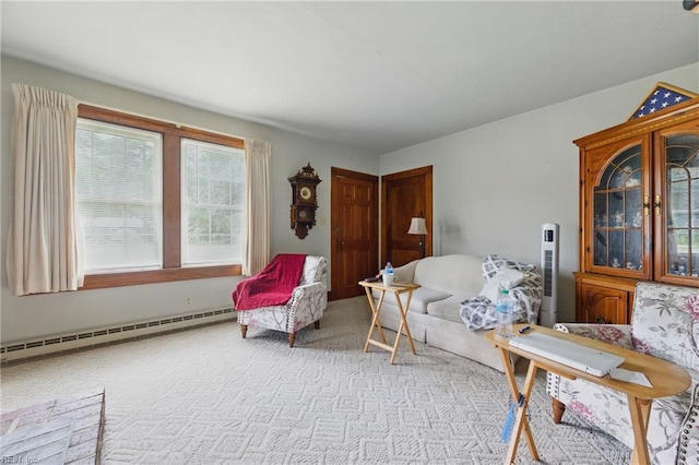 living area featuring baseboard heating and carpet
