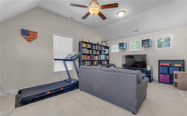 living room featuring carpet floors, ceiling fan, lofted ceiling, and a healthy amount of sunlight