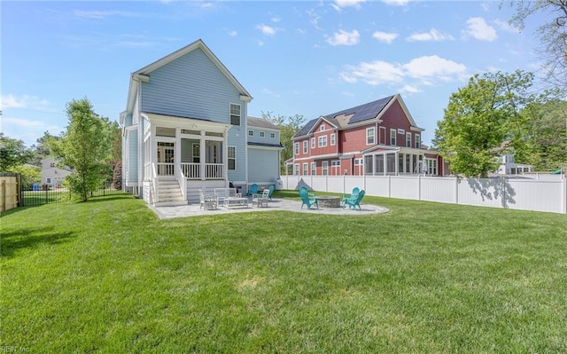 1870 Rockwood Dr, Chesapeake, VA 23323 - back of property featuring a fenced backyard, entry steps, a patio, a yard, and a fire pit