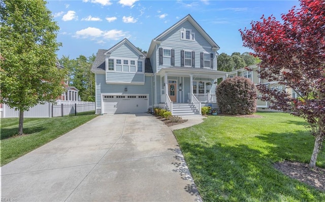traditional-style home with covered porch, fence, a front lawn, concrete driveway, and an attached garage