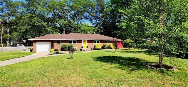 ranch-style house featuring concrete driveway, an attached garage, fence, and a front lawn