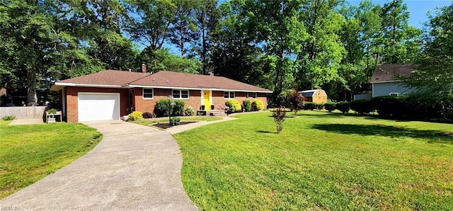 single story home with a garage, a front lawn, fence, and driveway