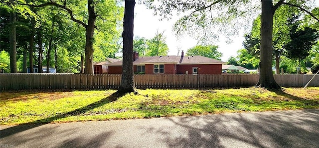 view of side of property with fence