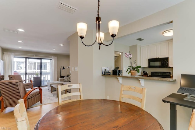 dining room with visible vents, recessed lighting, a chandelier, and light wood-type flooring