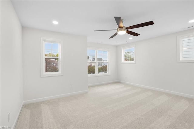 unfurnished room with ceiling fan, light carpet, recessed lighting, baseboards, and visible vents