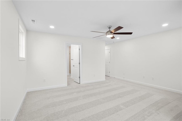 unfurnished room featuring a ceiling fan, baseboards, light colored carpet, and recessed lighting