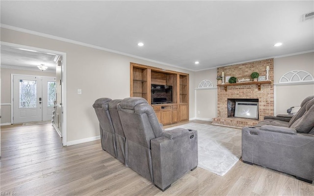 living room featuring crown molding, a brick fireplace, light wood-style floors, baseboards, and recessed lighting