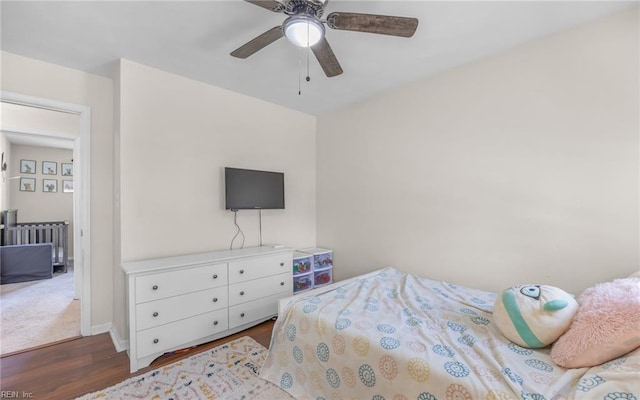 bedroom with ceiling fan and wood finished floors