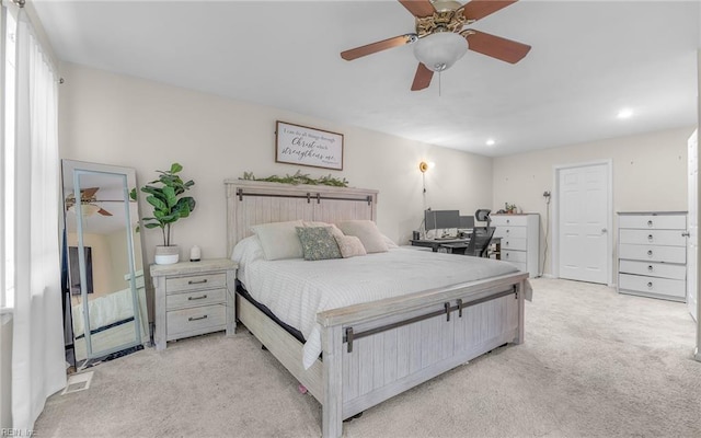 bedroom featuring recessed lighting, a ceiling fan, visible vents, and light carpet