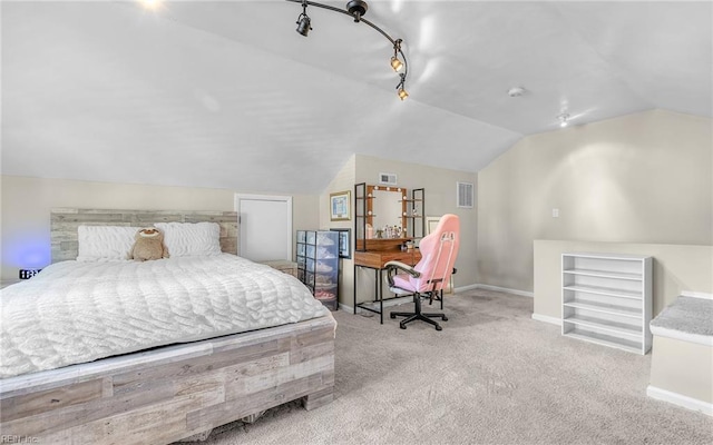 carpeted bedroom featuring baseboards, vaulted ceiling, and visible vents