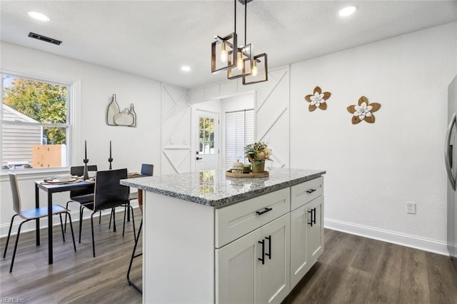 9 W Bayberry Ct, Hampton, VA 23669 - kitchen with visible vents, light stone countertops, baseboards, dark wood-style floors, and white cabinetry