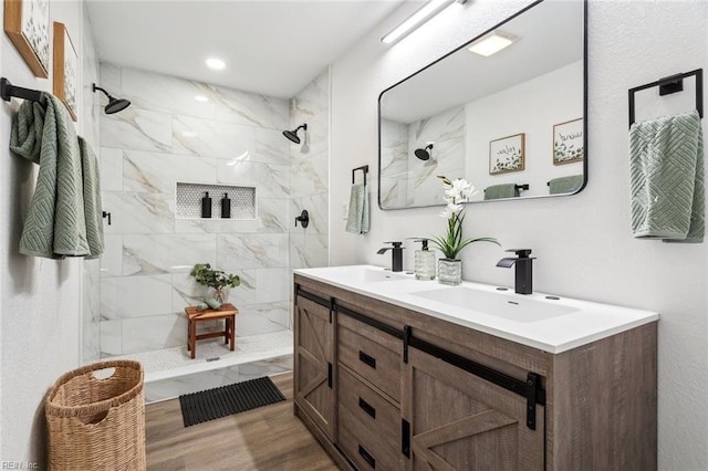 9 W Bayberry Ct, Hampton, VA 23669 - bathroom featuring double vanity, a sink, wood finished floors, and a shower stall
