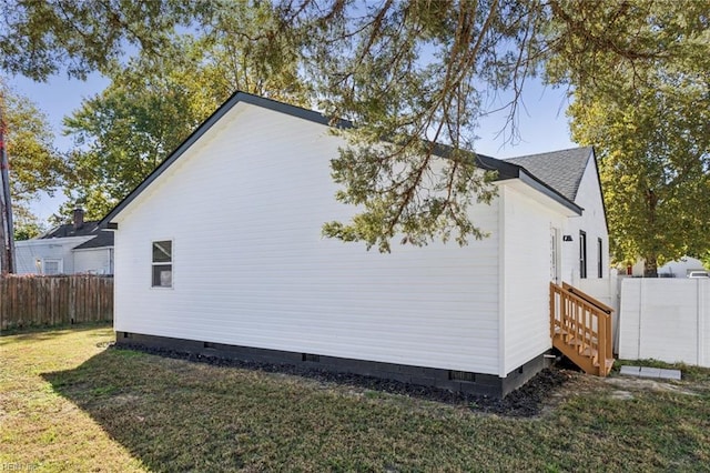 9 W Bayberry Ct, Hampton, VA 23669 - view of property exterior featuring a lawn, roof with shingles, fence, and crawl space