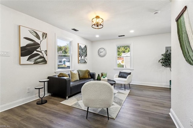 9 W Bayberry Ct, Hampton, VA 23669 - living room with baseboards, a notable chandelier, dark wood-type flooring, and visible vents