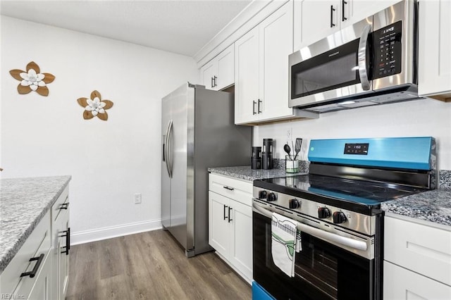 9 W Bayberry Ct, Hampton, VA 23669 - kitchen with appliances with stainless steel finishes, white cabinets, and dark wood finished floors