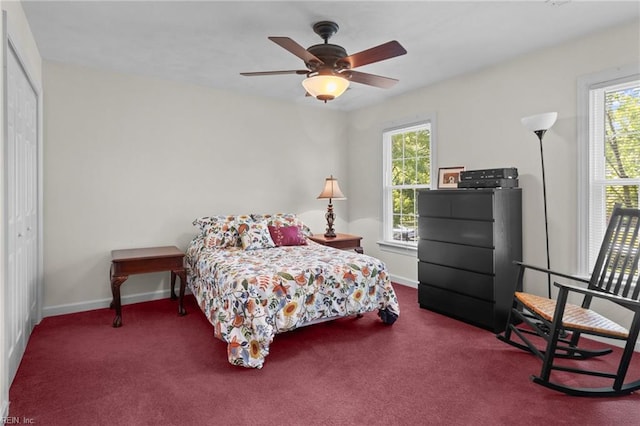 carpeted bedroom featuring baseboards, ceiling fan, and a closet
