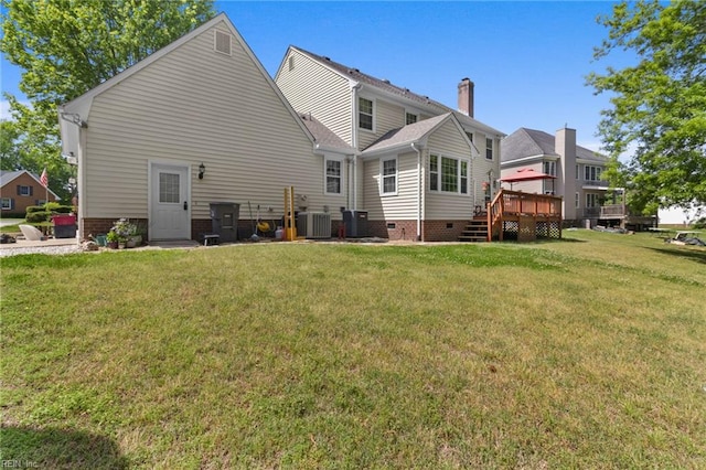back of house with a lawn, crawl space, cooling unit, and a wooden deck