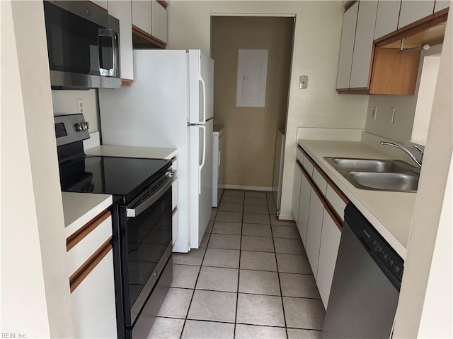 700 Rapidan River Ct Unit D, Chesapeake, VA 23320 - kitchen with light tile patterned flooring, appliances with stainless steel finishes, a sink, light countertops, and baseboards